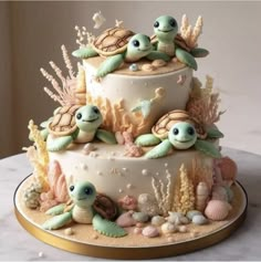 a three tiered cake decorated with sea animals