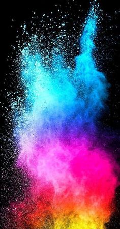 colorful powder is being thrown into the air