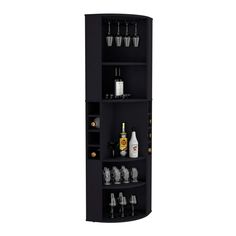 a tall black shelf with liquor glasses and bottles on the bottom shelves, in front of a white background