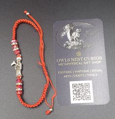 Red Santa Muerte Bracelet, Pulsera Santa Muerte Roja.  Carry Santa Muerte with you by reminding yourself you are grounded and protected with this beautiful, simple, red string Santa Muerte bracelet.  This is a discreet bracelet and can be safely kept close to you or carried with you and/or worn.  After cleansing your bracelet you can dedicate this bracelet to Santa Muerte and make her an offering of gratitude that fills your heart.  Thick red thread and Santa Muerte talisman almost an inch tall. Thin Bracelet. Three genuine crystal beads, with clear cubic zirconia separators on each side of the Santa Muerte talisman Red Santa Muerte, Eco Friendly Gift Wrapping, Bracelet Simple, Red String, Red Thread, Swarovski Crystal Beads, Best Candles, Eco Friendly Gifts, Braided Bracelets