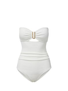 A timeless summer staple, the sleek Lisa Bandeau One Piece swimsuit features a sweetheart neckline, an elevated gold hammered U-ring trim and a sexy and subtle peekaboo. Perfect for the beach or your hotel rooftop pool, this swimsuit is made from a textured recycled fabric which offers SPF 50+ protection.. Hidden boning at the bust provides additional support, and slight ruching results in a flattering, feminine fit.. A removable, adjustable, convertible strap allows fit versatility. DETAILS Col Elegant Gold Swimwear For Poolside, Elegant Bandeau Swimwear For Beach Season, Elegant Bandeau Swimwear For Beach, Elegant Strapless Swimwear For Beach, Elegant Strapless Swimwear For Summer, Elegant Gold Swimwear For Beach, Elegant White Bandeau Swimwear, Elegant Gold Swimwear For Summer, Chic White Strapless Swimwear