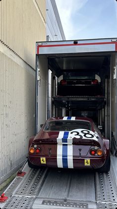 the car is being loaded into the truck