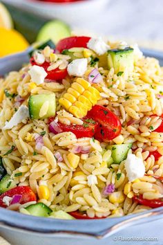 a blue bowl filled with pasta salad