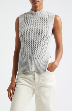 The Italian label's signature blend of relaxation and luxury shines in this alpaca-kissed sweater-tank boasting ribbed edges and an ornate openwork body. Mock neck Side slits 48% alpaca, 23% metallic fibers, 21% polyamide, 8% wool with 55% cotton, 45% polyester contrast Dry clean or machine wash, dry flat Made in Moldova Designer Clothing Chic Pointelle Knit Vest, Elegant Sleeveless Knit Sweater, Chic Sleeveless Pointelle Knit Sweater, Fitted Fine Knit Sleeveless Sweater, Mohair Tops For Fall, Fitted Sleeveless Fine Knit Sweater, Chic Open Knit Sweater Vest For Fall, Chic Fitted Open Knit Sweater Vest, Winter Sleeveless Pointelle Knit Sweater Vest