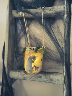 a potted plant sitting on top of a wooden shelf