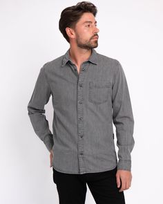 Amsterdam Heritage introduces the Flagler denim shirt for its menswear collection. Featuring a front pocket and snap button closure, the long-sleeved shirt is made from pure cotton, creating a lightweight and comfortable feel for the wearer. Adorned with our brand's logo, presented subtly in the back and side stitching, the Flagler is the ultimate classic denim shirt for every occasion. Never going out of style nor going out of season, style it with a blazer for a semi-casual look or match it wi Washed Black Cotton Shirt With Pockets, Washed Black Cotton Button-up Shirt, Casual Washed Black Button-up Shirt, Urban Cotton Button-up Shirt, Washed Black Cotton Shirt With Button Closure, Washed Black Long Sleeve Shirt With Relaxed Fit, Washed Black Long Sleeve Shirt With Button Closure, Long Sleeve Washed Black Shirt With Button Closure, Casual Washed Black Long Sleeve Shirt