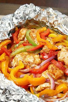 chicken fajita in foil with peppers and onions