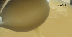 a ladle full of milk being poured into a bowl with the word mabbel on it