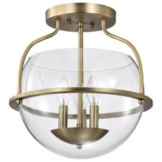 a semi flush ceiling light with two clear glass globes on the front and bottom