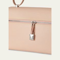 Loro Piana crossbody bag in saffiano leather and metal alloy  Flat top handle  Detachable, adjustable crossbody strap with clochette tag  Can be worn as a top handle or crossbody bag  Two-way zip top closure with padlock accent  Interior, flap pouch  Approx. 6.3"H x 10.6"W x 3.9"D Wipe clean Made in Italy Modern Travel Bag With Lock, Office Shoulder Bag In Saffiano Leather With Silver-tone Hardware, Modern Travel Shoulder Bag With Lock, Top Handle Leather Bags With Lock For Everyday Luxury, Modern Top Handle Bags With Lock, Modern Satchel Bag With Lock, Modern Saffiano Leather Crossbody Satchel, Saffiano Leather Shoulder Bag With Palladium Hardware, Everyday Luxury Saffiano Leather Bag With Detachable Strap