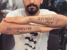 two arm tattoos with roman numerals on them, and the words xyzmmxxii