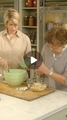 two women are in the kitchen preparing food