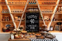 a display in a store filled with lots of bottles and other items on wooden shelves