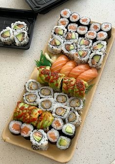 sushi platter with various types of sushi on it