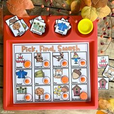 a red tray filled with pictures of different foods and animals on top of wooden table