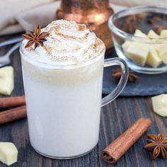 hot chocolate latte with whipped cream and cinnamon on wooden table - stock photo - images