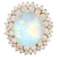 Stamped: 14K Yellow Gold Total Ring Weight: 9.1 Grams Total Natural Opal Weight is 5.50 Carat (Measures: 14.00x10.00 mm) Color: Multicolor Total Natural Diamond Weight is 1.70 Carat Color: F-G, Clarity: VS2-SI1 Face Measures: 21.65x20.25 mm Sku: [704122W] Dream Rings, Sapphire Cocktail Ring, Opal Diamond Ring, Yellow Gold Diamond Ring, Gold Cocktail Ring, Diamond Cocktail Rings, Gold Diamond Ring, La Face, Diamond Flower