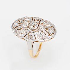 This is part of Chairish’s Fine Jewelry assortment.  Finely detailed antique Art Nouveau diamond ring (circa 1910s) crafted in 18k yellow gold & 900 platinum.   Old mine & rose cut diamonds total an estimated at 1 carat (estimated at K-L color and SI2-I2 clarity).    The beautiful platinum topped Edwardian era ring is set with glimmering old mine and rose cut diamonds. With fine mile grain detail the oval shaped mount is larger in scale (approx. 1 x 1/2 inch) and makes a nice statement on the ha Oval Platinum Diamond Ring With 17 Jewels, Antique Oval Hallmarked Diamond Ring, Heirloom Oval Cluster Ring With Rose Cut Diamonds, Victorian Oval Diamond Ring With Rose Cut Diamonds, Vintage Oval Signet Ring With Brilliant Cut, Art Deco Oval Diamond Ring With Accents, Oval Art Deco Hallmarked Diamond Ring, Victorian Marquise Yellow Gold Diamond Ring, Antique Platinum Yellow Gold Rings