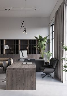 an office with two black chairs and a wooden desk