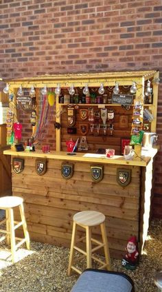 an outdoor bar with stools and shelves