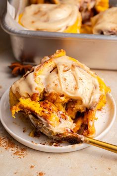 a white plate topped with food covered in icing