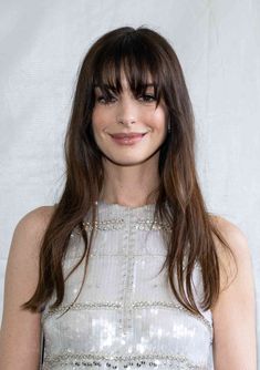 25 Chic French Girl Bangs to Send to Your Stylist ASAP Medium French Haircut, Anne Hathaway Hair Bangs, French Girl Bangs Long Hair, Wispy French Bangs, Anne Hathaway Bangs, French Girl Bangs, Anne Hathaway Hair, Bang Inspo, Celebrity Bangs