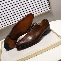 These Italian Oxford shoes for men are exquisitely handstiched and hand painted to perfection. The brown and dark brown colored dress shoes are made from genuine leather and rubber to give you an executive look, comfort and durability. They are wedding shoes with a pointed toe shape and a lace-up closure for use during the spring and autumn.

Specifications
Brand Name: GeraldBlack
Upper Material: Genuine Leather
Upper-Genuine Leather Type: Cow Leather
Origin: CN(Origin)
Pattern Type: Hand-Painte