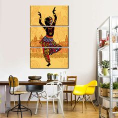 a room with a table, chairs and pictures on the wall above it that has a woman dancing