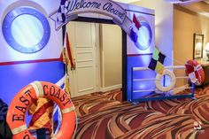 the entrance to a boat themed hotel with life preserver and life buoy on display