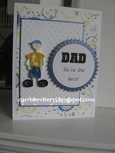 a father's day card with a boy holding a button on the back of it