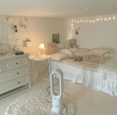 a bedroom with two beds and lights on the wall