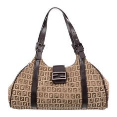 * Fendi Shoulder Bag * Neutrals Canvas * Graphic Print * Zucchino Ff Logo * Gunmetal Hardware * Leather Trim * Dual Shoulder Straps * Canvas Lining & Single Interior Pocket * Snap Closure At Front Approximate Measurements: * Shoulder Strap Drop: 9" * Height: 9.25" * Width: 13" * Depth: 4.75" Condition: Good * Moderate Creasing At Straps And Trim; Light Scratches At Hardware; Faint Marks At Bottom; Scuffs On Piping. Vintage From The Early 2000s Y2k Era Comes With Dustbag And Authenticity Card Inventory: C15mas*Vgeb Fendi Shoulder Bag, Fendi Vintage, Y2k Era, Gunmetal Hardware, Ff Logo, Early 2000s, Leather Trim, Leather Trims, Snap Closure