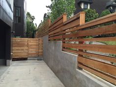 a wooden fence on the side of a building