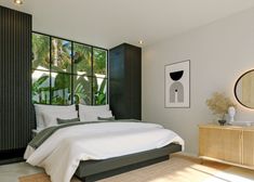 a bedroom with a bed, dresser and large window in front of the wall that has plants on it