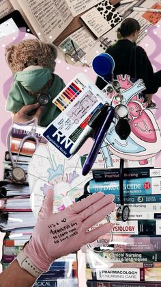 a collage of books, scissors, and other items in front of a person's hand