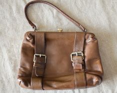 "Vintage antique chestnut color Leather purse - medium size bag. Dark brown Leather Handbag, evening bag with golden tone closure and frame. The frontal straps is decorative only with various sizes. The bag has 1 open way inside compartment, 2 loose compartments and one inside zippered pocket, too. condition: visually great bag.In the lining inside are some dark spots. measurements: height without handles 19 cm / 7.5\" in width 24,5 cm / 9.6\" in" Brown Leather Handbag, Brown Leather Purse, Italian Bags, Brown Leather Crossbody Bag, Chestnut Color, Brown Leather Handbags, Bag Dark, Boho Accessories, Brown Handbag