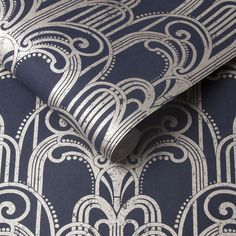 a blue and white wallpaper with an intricate design on it's side,