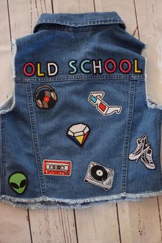 an old school denim vest with patches on it