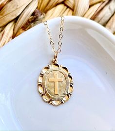 Our medallion cross necklace is perfect for everyday, special occasions, religious events gifts for mom, wife, anniversaries, and other special occasions. This beautiful shimmering piece is 14K gold filled and looks amazing layered, or dainty all on its own. W H Y ∙ Y O U ' L L ∙ L O V E ∙ I T• It's delicate and can be worn every day• A classic special piece you will surely treasure• High-quality materials and attention to detail• All jewelry has a 1-year guarantee (see policies)P R O D U C T • 14k Gold Filled Cross Jewelry Gift, Gold Dainty Cross Pendant Charms, 14k Gold Filled Cross Pendant Necklace As Gift, 14k Gold Filled Cross Necklace Gift, Gold Cross Charm Necklace For Spiritual Style, Gold Cross Charm Necklace Spiritual Style, 14k Gold Filled Cross Charm Necklace As Gift, 14k Gold Filled Cross Charm Necklace For Gift, Spiritual Cross Pendant Necklace For First Communion