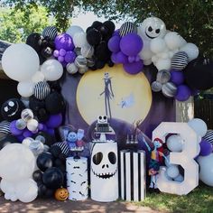 an assortment of balloons and decorations for a halloween party