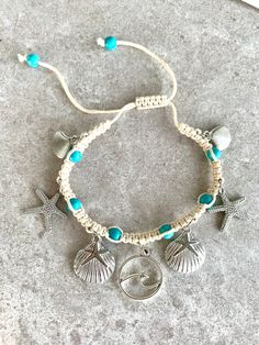 Adorn your leg with a gorgeous shell anklet! This macrame ankle bracelet with blue beads that resemble the ocean features silver starfish, shells and a wave charm.  *comes ready for gift giving in a jewelry pouch