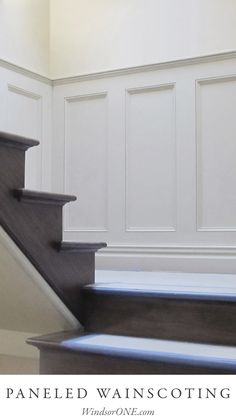 the stairs are painted white and have blue carpet