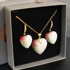 "Breastmilk Jewelry Rose Gold Heart Set earrings and necklace set with breastmilk Birth Color Shimmer from KeepsakeMom. A perfect set for the woman who loves accessorizing with matching earrings and necklace, our Birth Color Shimmer Set pairs a breastmilk heart shaped necklace and dangle breastmilk heart shaped earrings, together with one or two birth color shimmers and beautiful earring bails with cubic zirconia inlays. Yellow gold, rose gold or silver options available! Although its bail will Birth Colors, Gold Heart Earrings, Breastmilk Jewelry, Gold Heart Earring, Jewelry Heart, Heart Shaped Necklace, Set Earrings, Earrings And Necklace, Rose Gold Heart