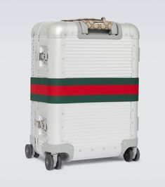 Find GUCCI Porter Web Stripe Carry-on Suitcase on Editorialist. Material: aluminum. Lining: fabric. Made in Italy. Designer color name: Silv/B.Eb/L.Gr/Vrv/N. Trim: fabric. Closure: push-lock fastening. Top handle, Telescopic handle with adjustable length. Internal details: internal zipped pocket, two internal compartments. Gucci Luggage, Gucci Travel Bag, Carryon Suitcase, Designer Suitcases, Porter Bag, Gucci Travel, Luxury Luggage, Canvas Leather Tote, Cabin Luggage