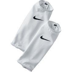 two white nike leg sleeves with black nike logo on the front and one has an attached zipper