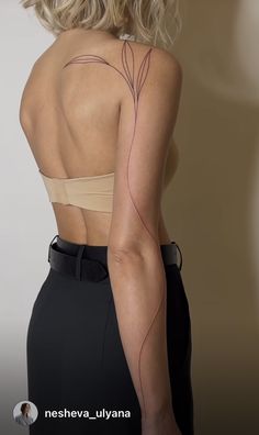 the back of a woman's body with lines drawn on her left shoulder and right arm