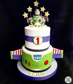 a birthday cake made to look like a toy story buzz lightyear with stars on top