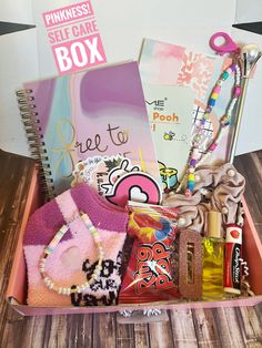 a pink box filled with lots of items