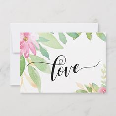 a card with the word love written in cursive writing and flowers on it