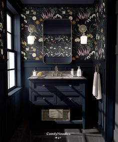 a bathroom with dark blue walls and floral wallpaper, along with a large mirror above the sink